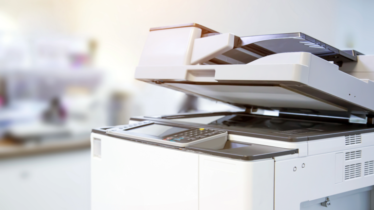 Close up of a photocopier or photocopy machine office equipment workplace for scanner or scanning document and printing or copy paper duplicate.