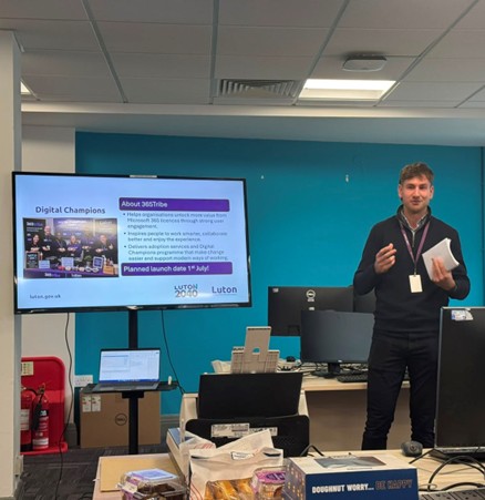 Photo of Ben McCartney, Head of Workplace Experience for Luton DDaT, presenting the latest infor about our Digital Champions programme.